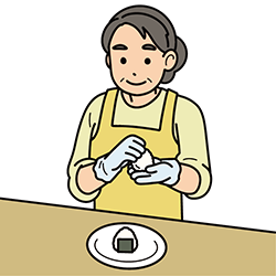 小さめのおにぎりを作る女性